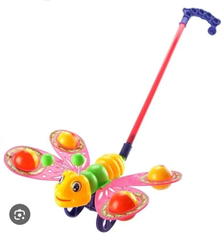 Baby pushing toy butterfly